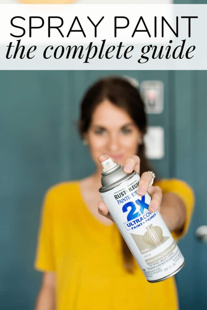 Woman holding up a can of spray paint, with text overlay - spray paint the complete guide