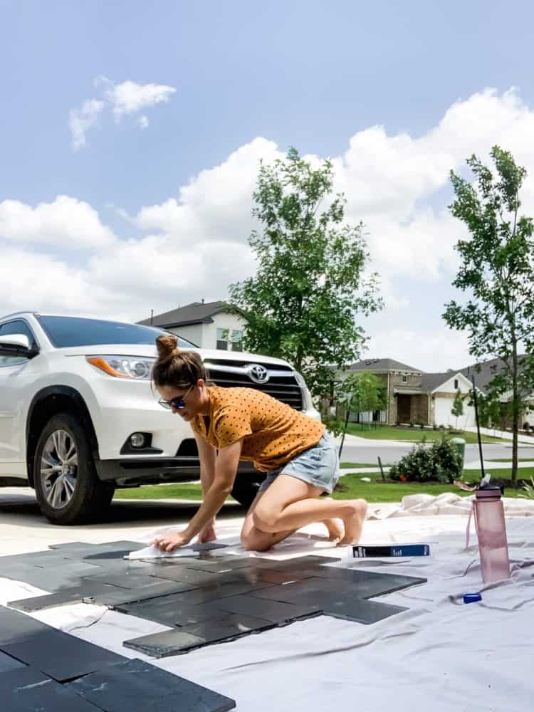 woman sealing basalt tiles with miracle sealants 511 impregnator