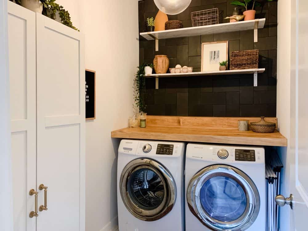 laundry room with tile accent wall 