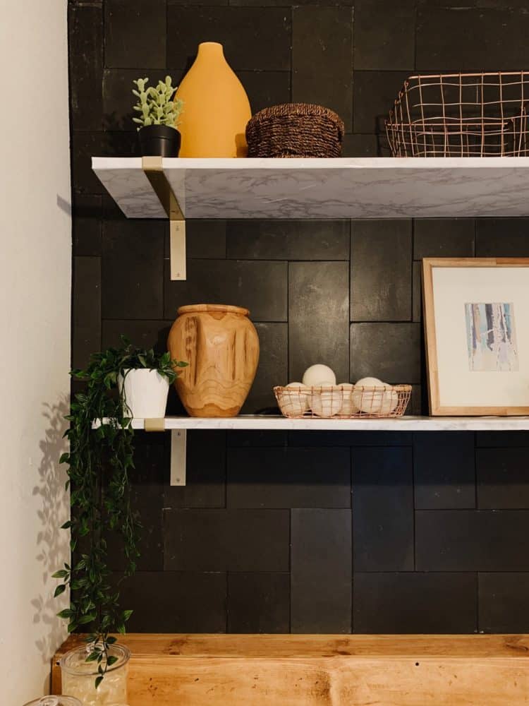 DIY faux marble shelving in a laundry room