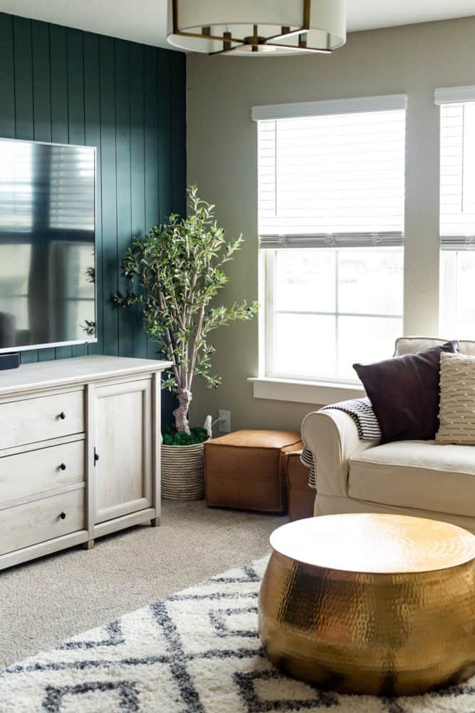 family room with dark green shiplap