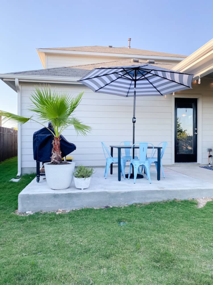 Patio with grill and small eating area 