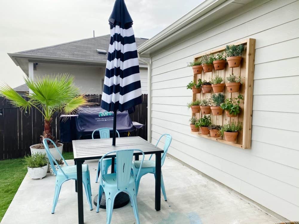 patio with a vertical hanging herb garden