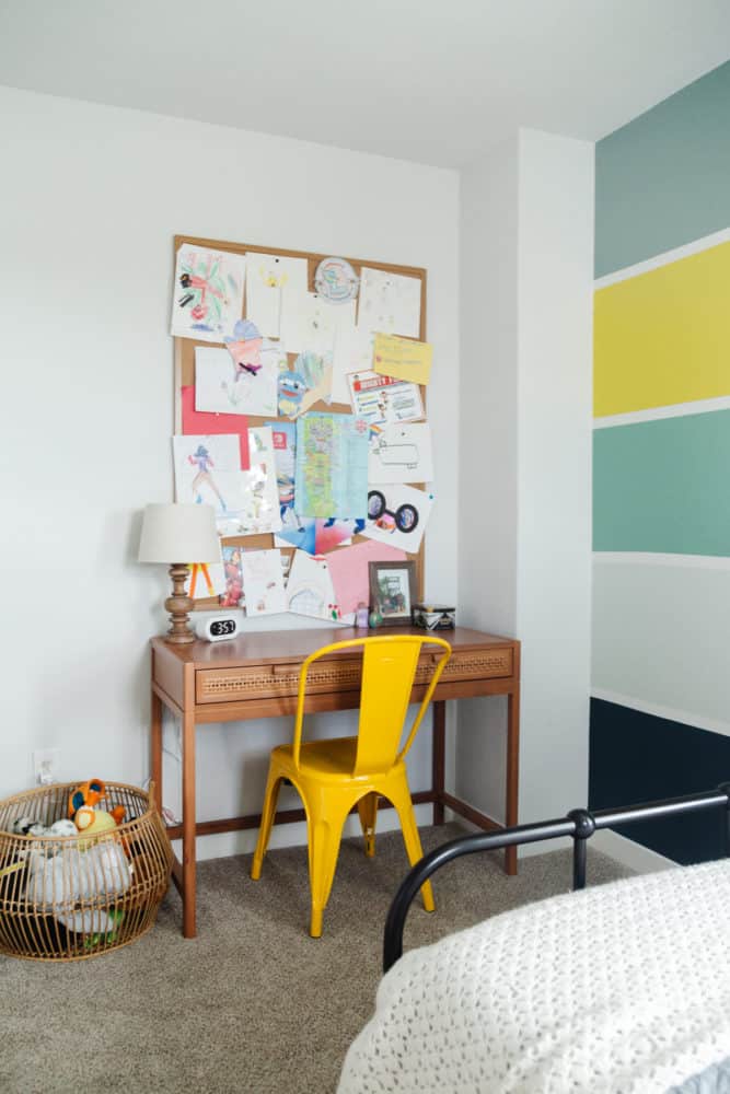 kid room with desk and large bulletin board