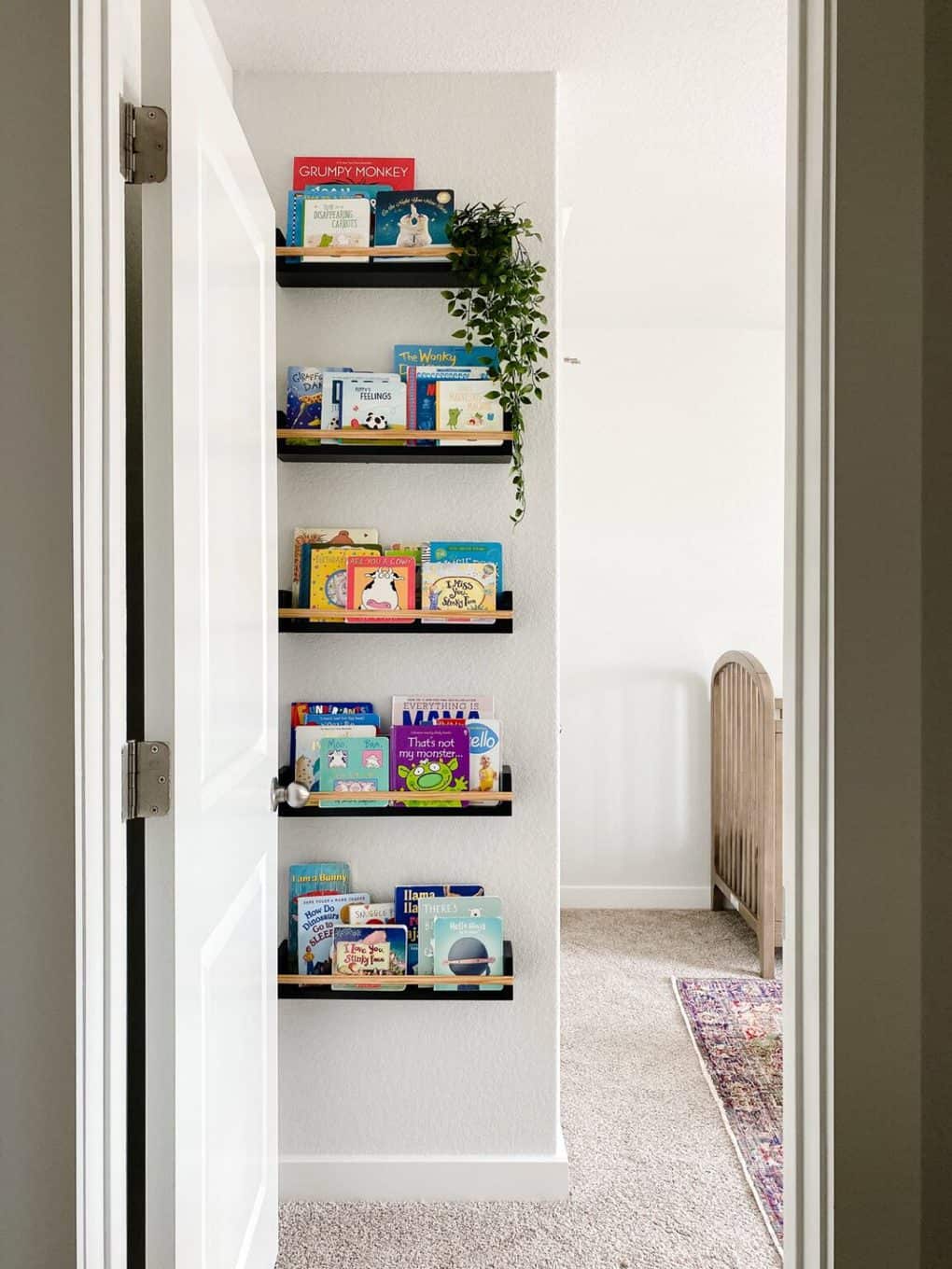 simple book ledges hanging in a nursery