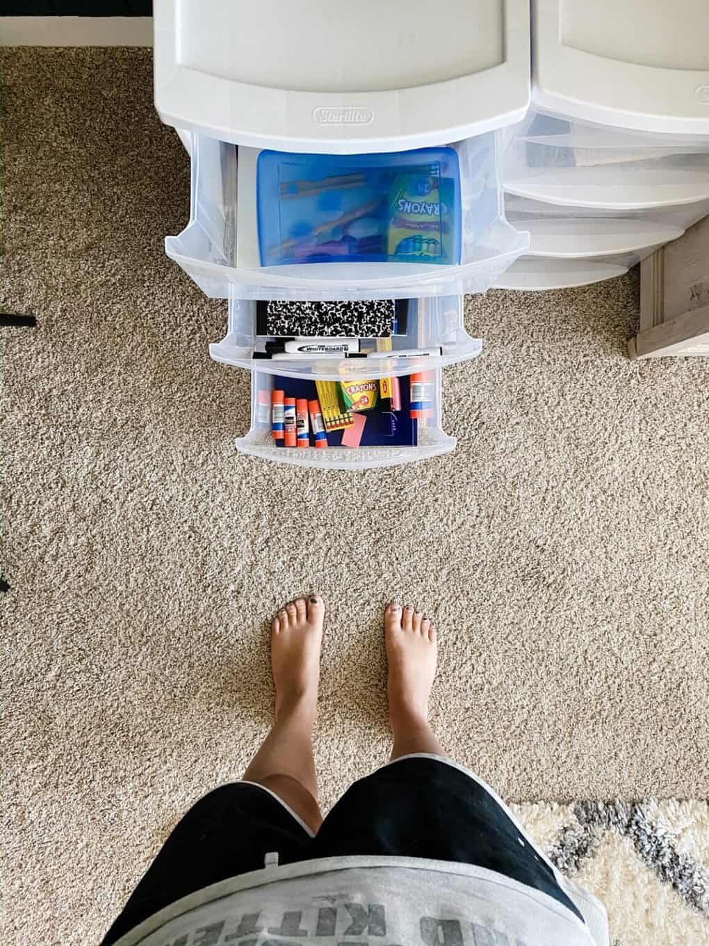 plastic drawers set up with school supplies 