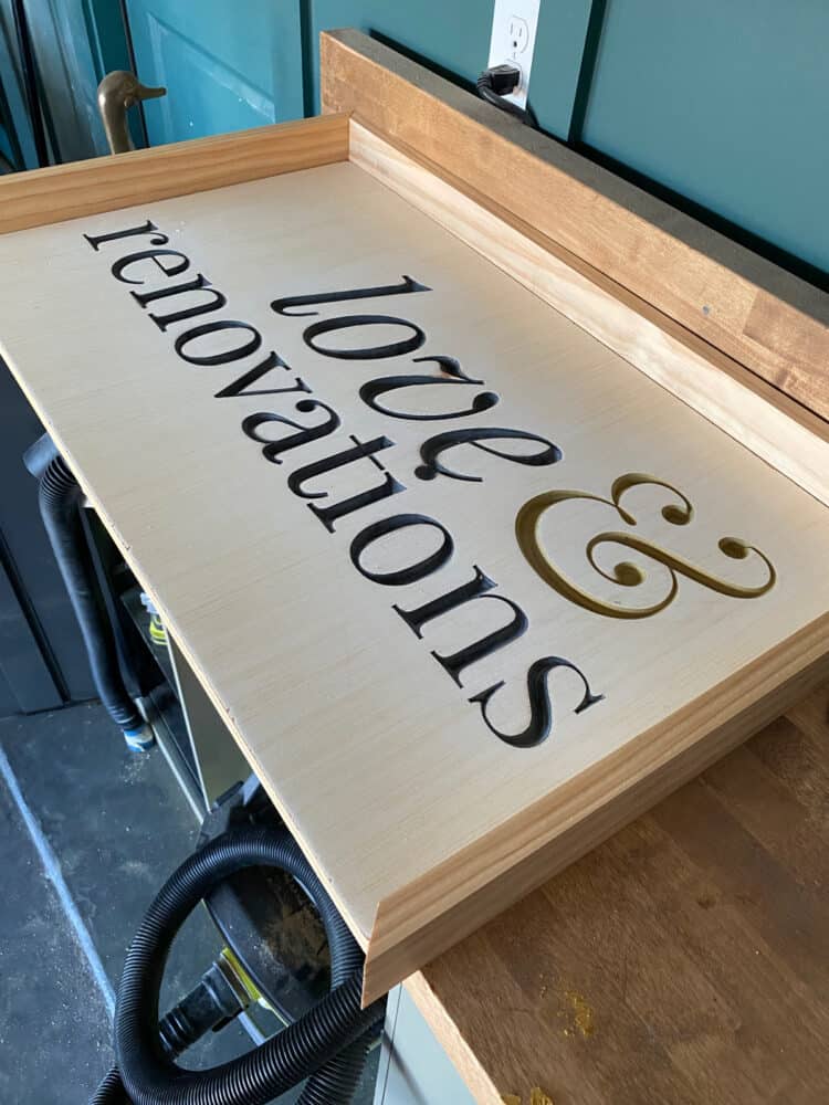 frame being added to DIY wood sign