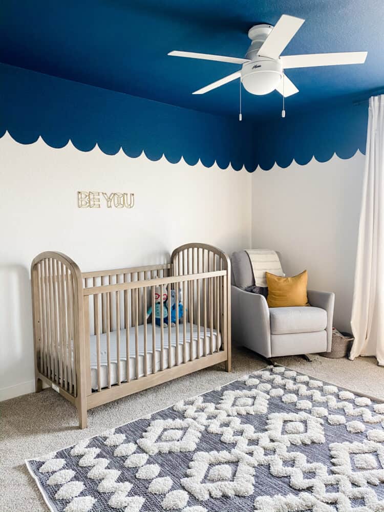nursery with blue ceiling with scalloped edges