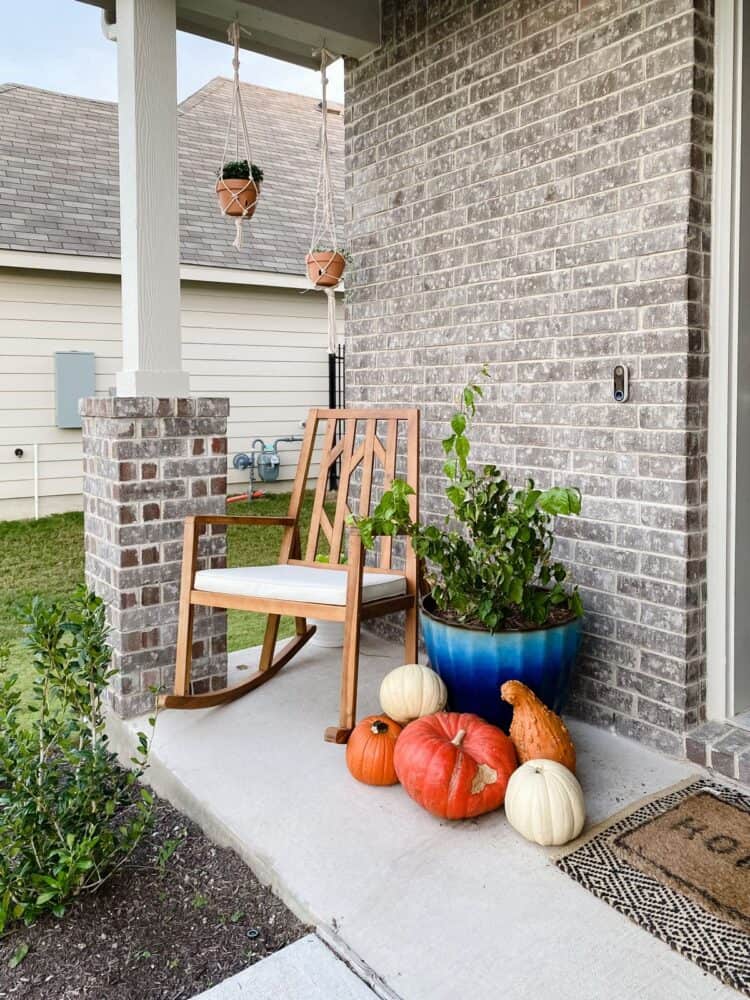 front porch with pumpkins and DIY macrame hanging planters 