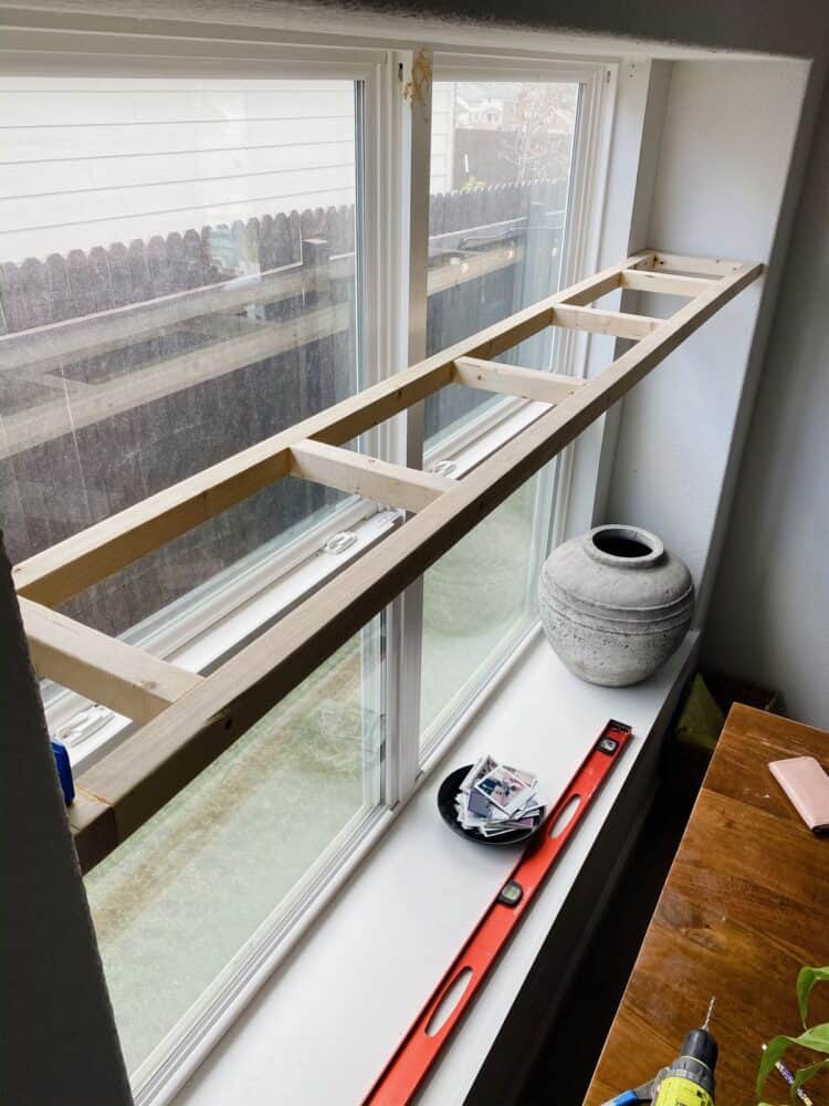 Framing for DIY plant shelf hung in a window