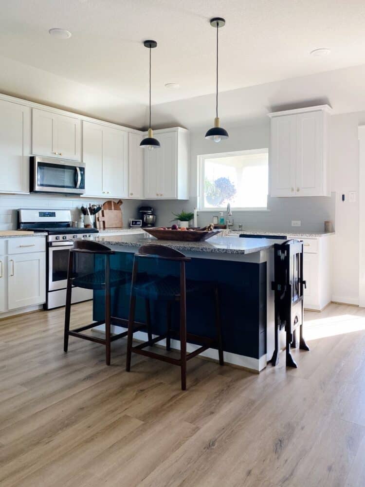 white kitchen with dark gray island