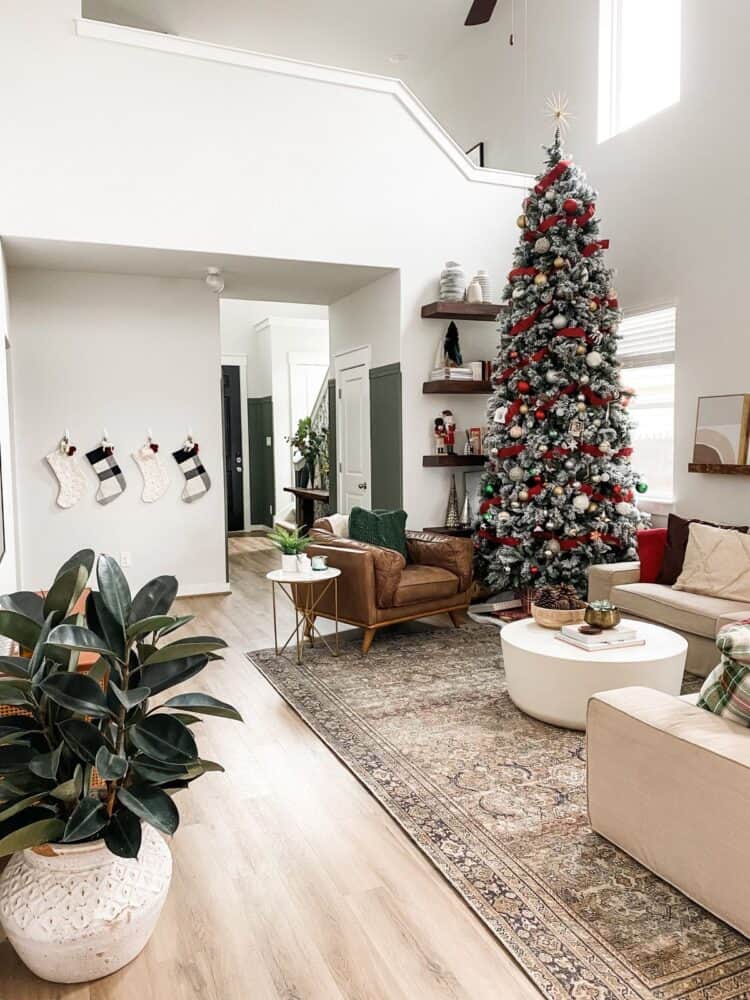 wide view of living room with 12-foot tall Christmas tree 