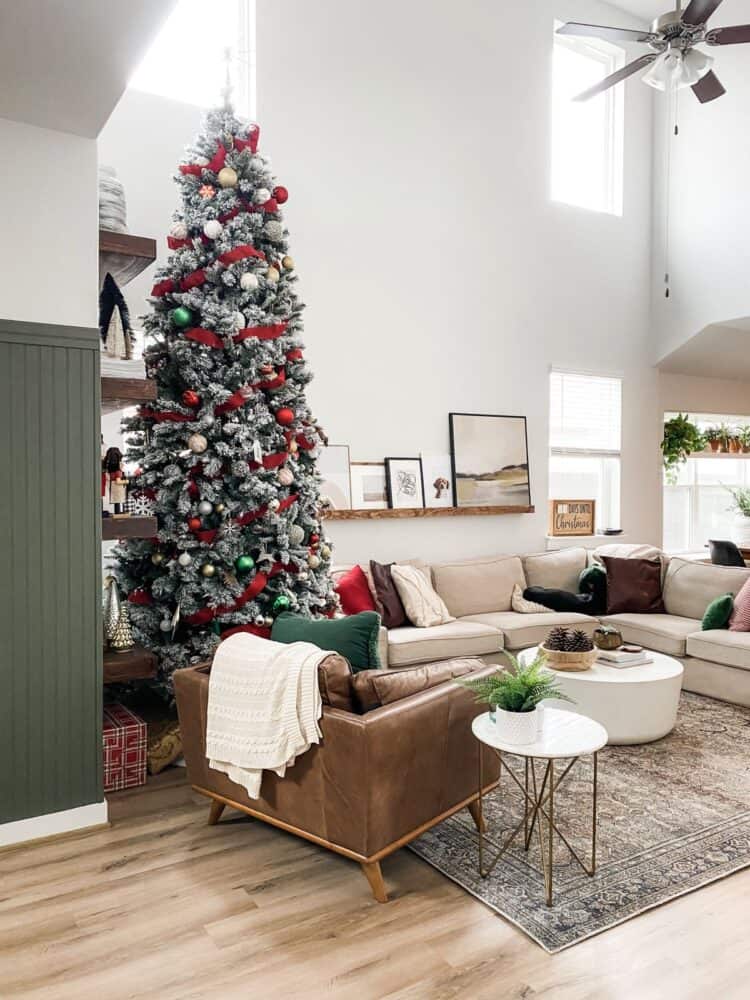 cozy and neutral living room with tall Christmas tree 