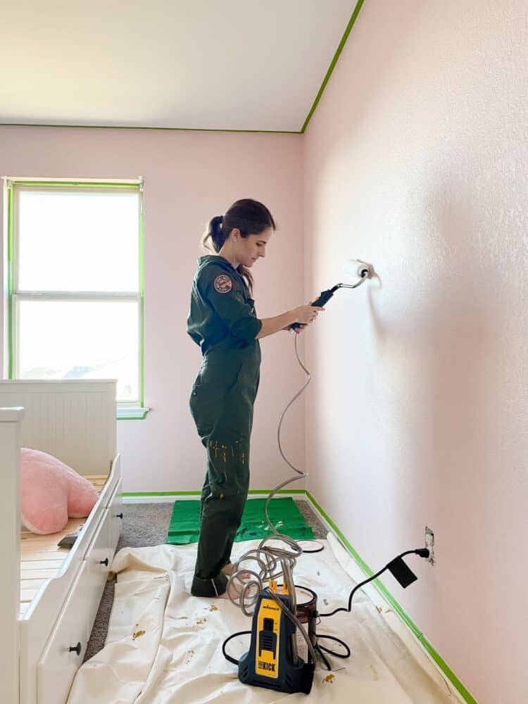 woman painting a room using Wagner's Sidekick Power Roller 