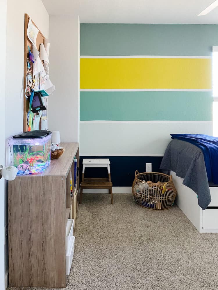 A kid's bedroom with striped walls