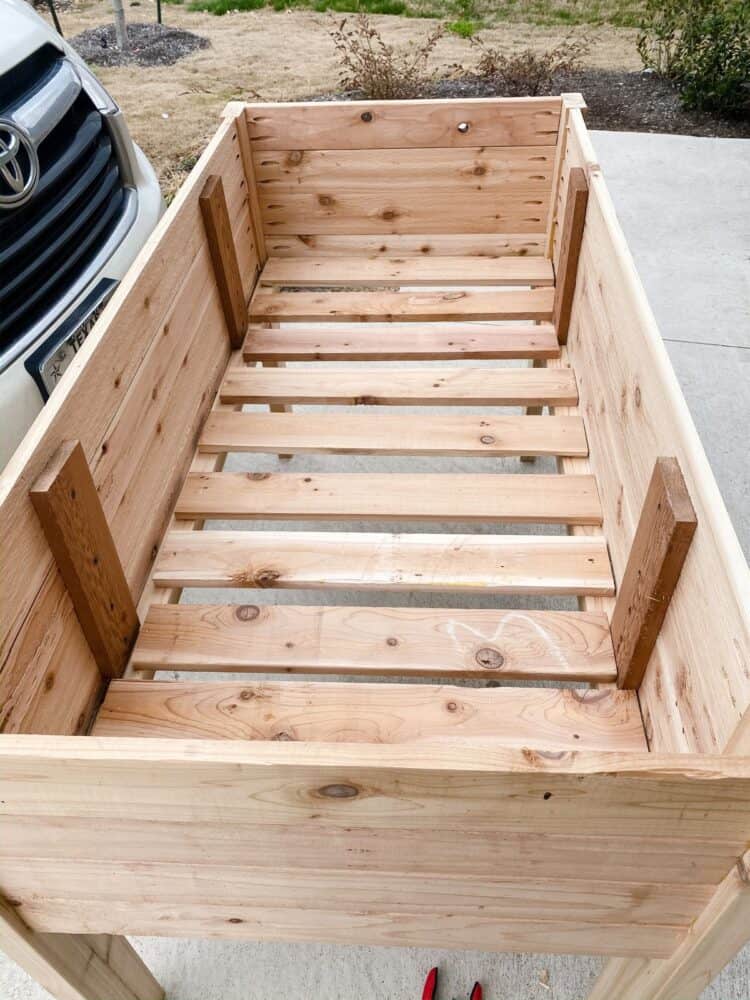 the bottom of a DIY raised planter bed 