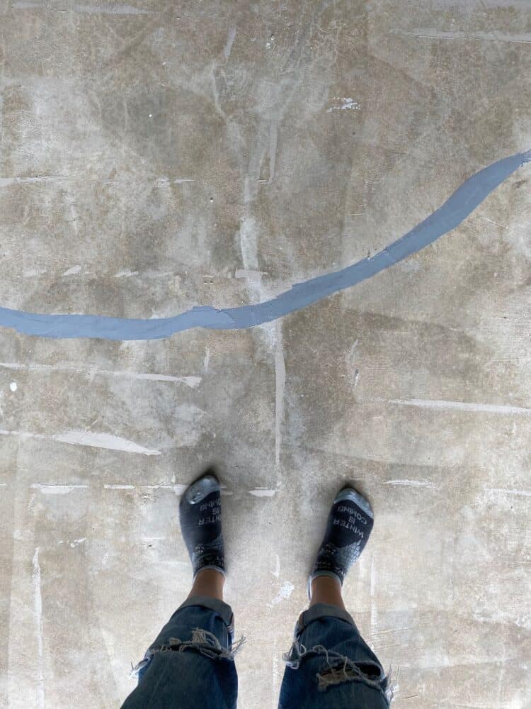 crack in a concrete floor that has been patched