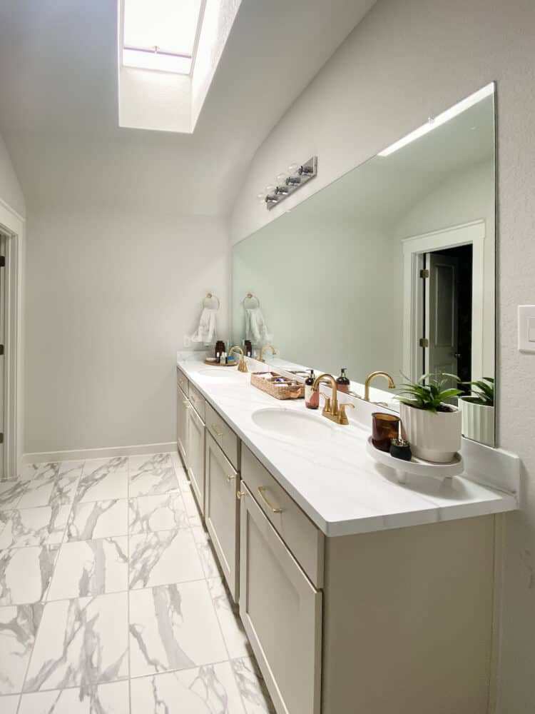 wide angle image of a primary bathroom with a VELUX skylight 