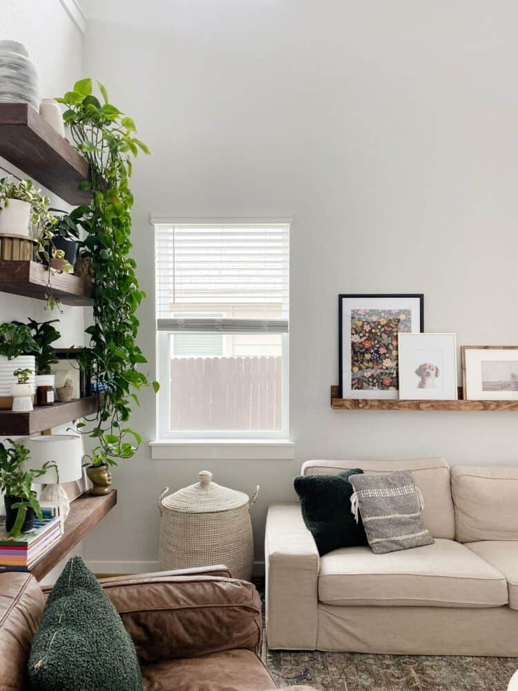 corner of a neutral living room with a large Serena & Lily La Jolla basket 