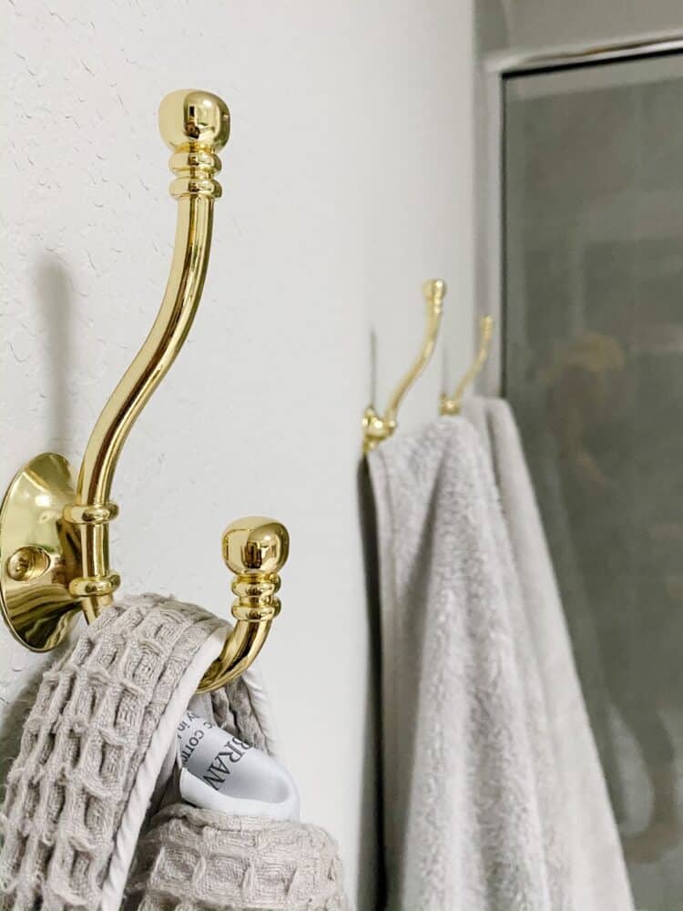 close up image of gold towel hooks
