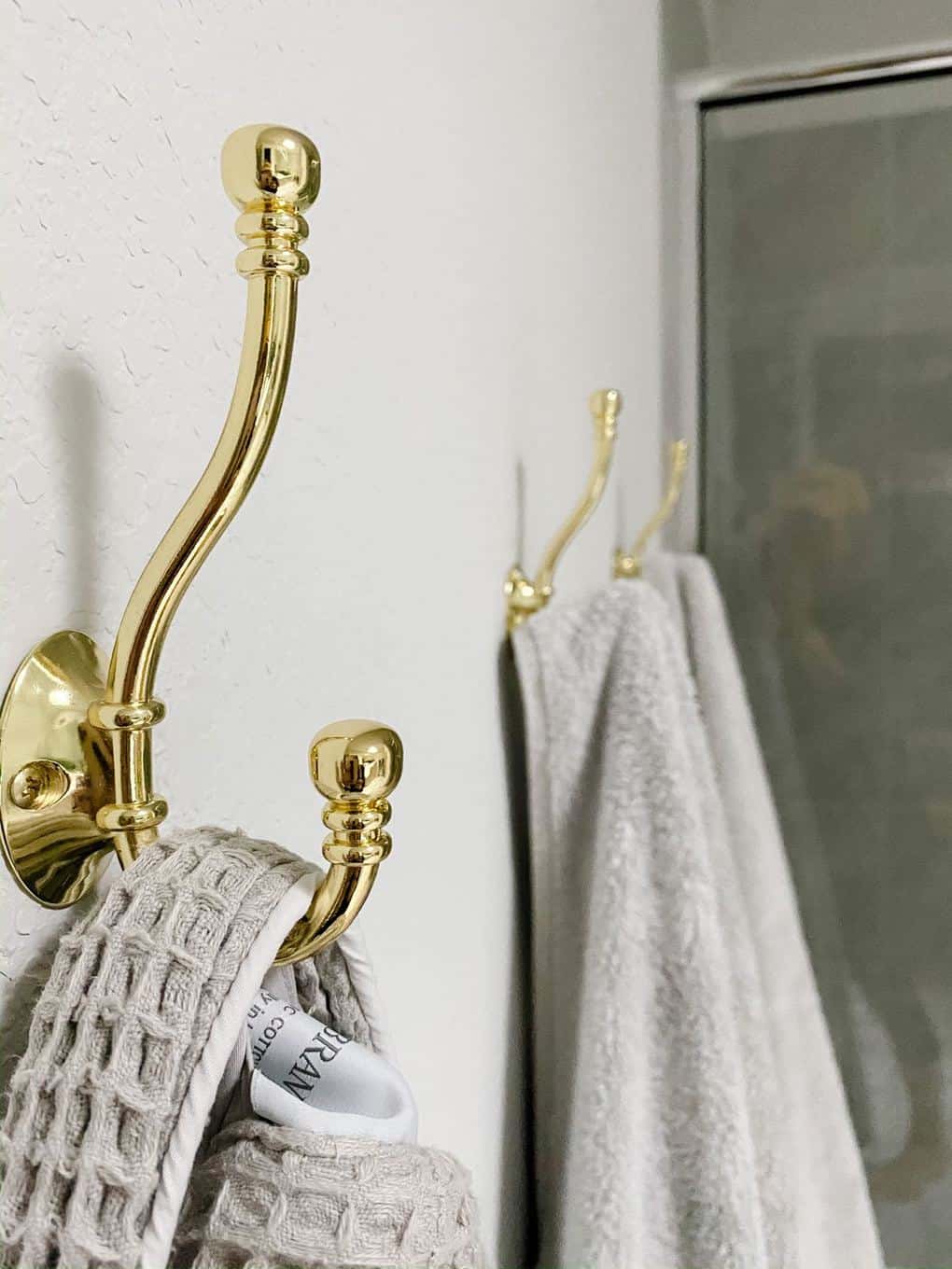 anyone install hooks or towel racks inside the shower?