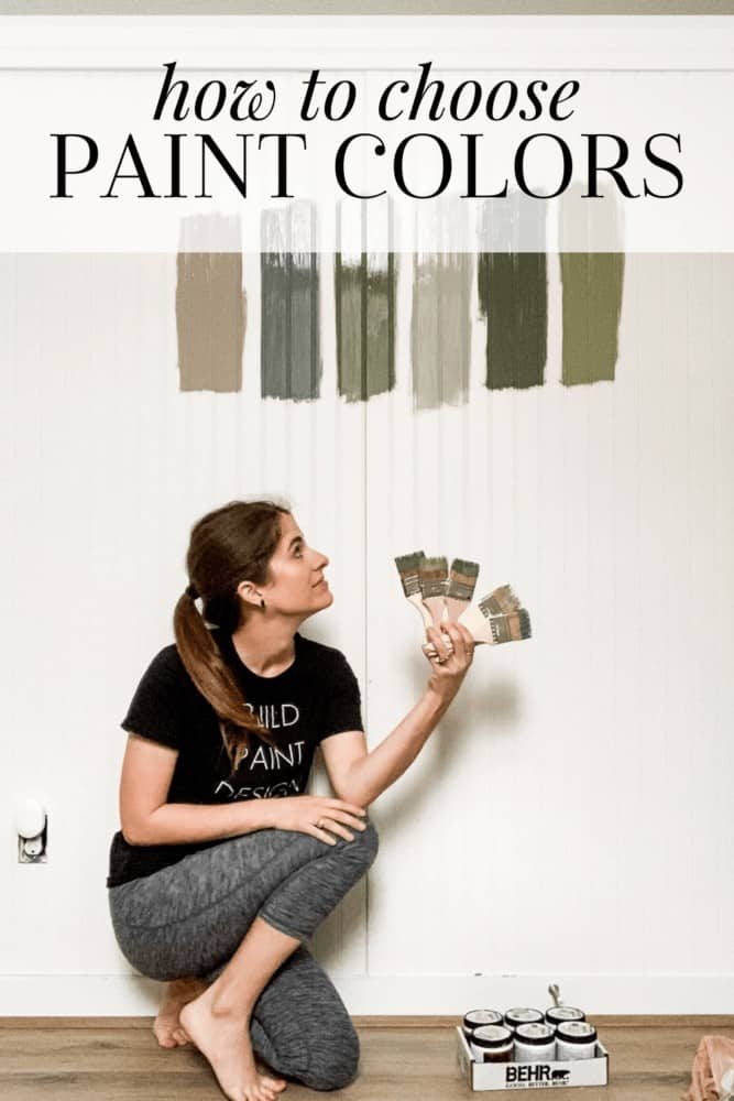 woman looking at paint samples on a wall with text overlay that says "how to choose paint colors"