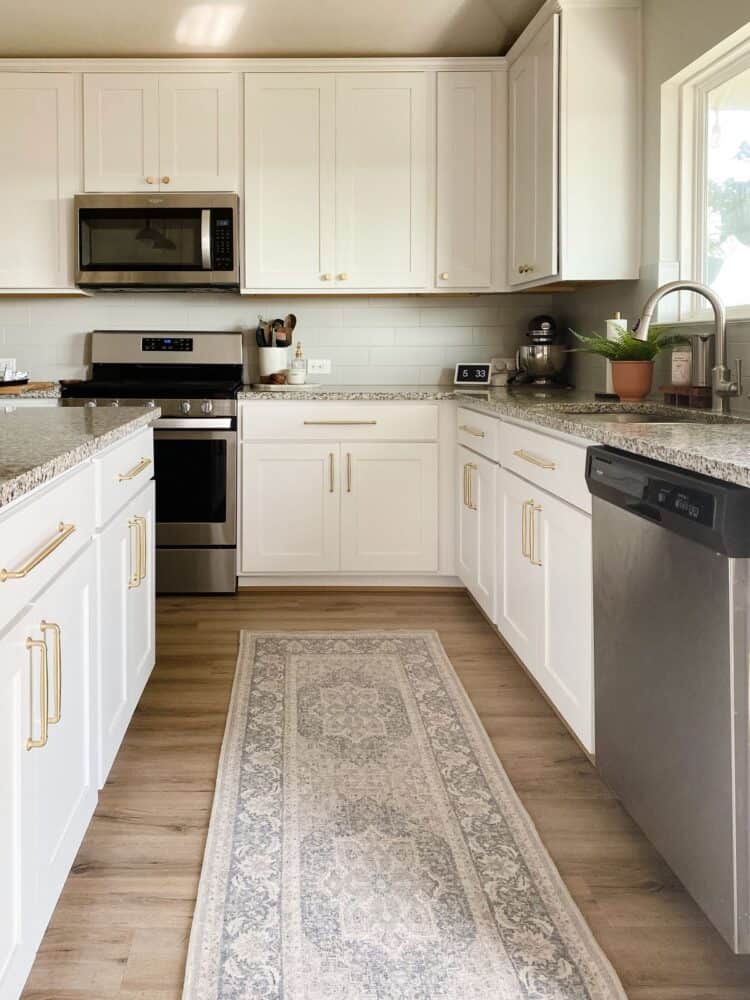 all-white kitchen with a vintage-style Ruggable runner 