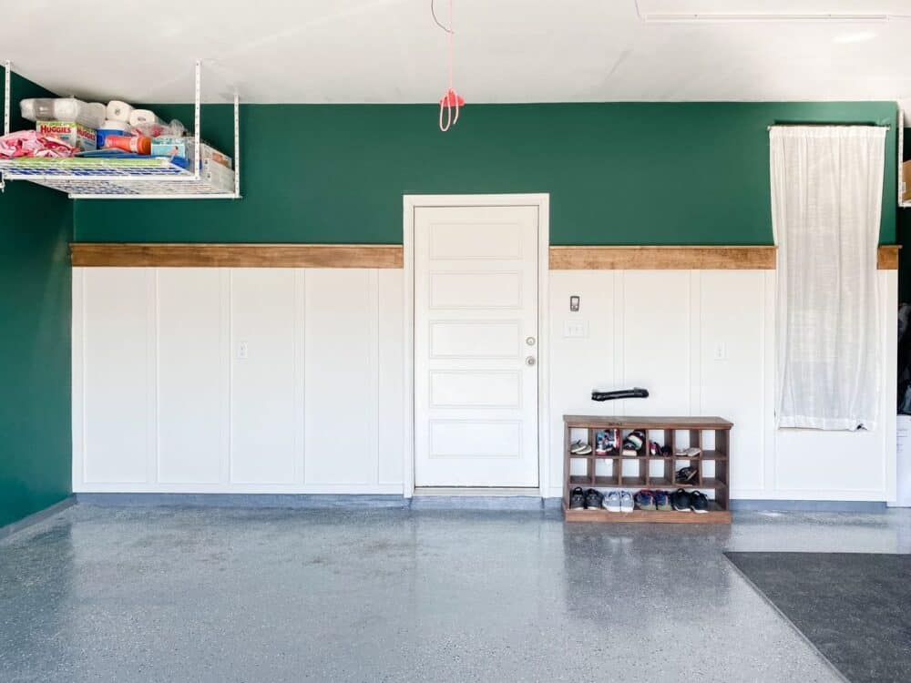 A garage with a farmhouse style board and batten accent wall