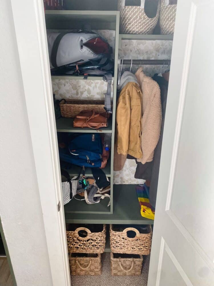 entry closet with built-in shelving 