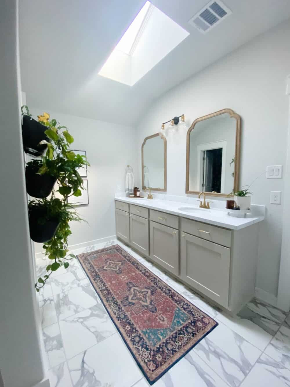 bright and light master bathroom with skylight 