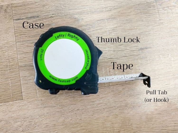 Close up image of a tape measure with all important parts labeled