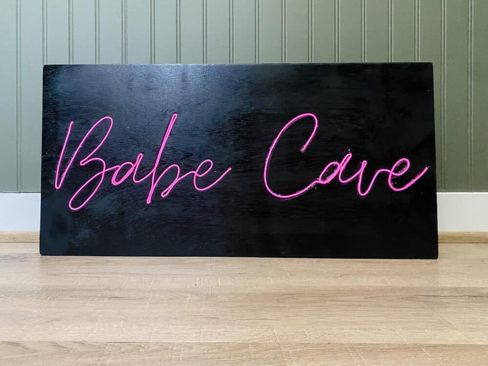 close up of DIY neon sign that says "babe cave"