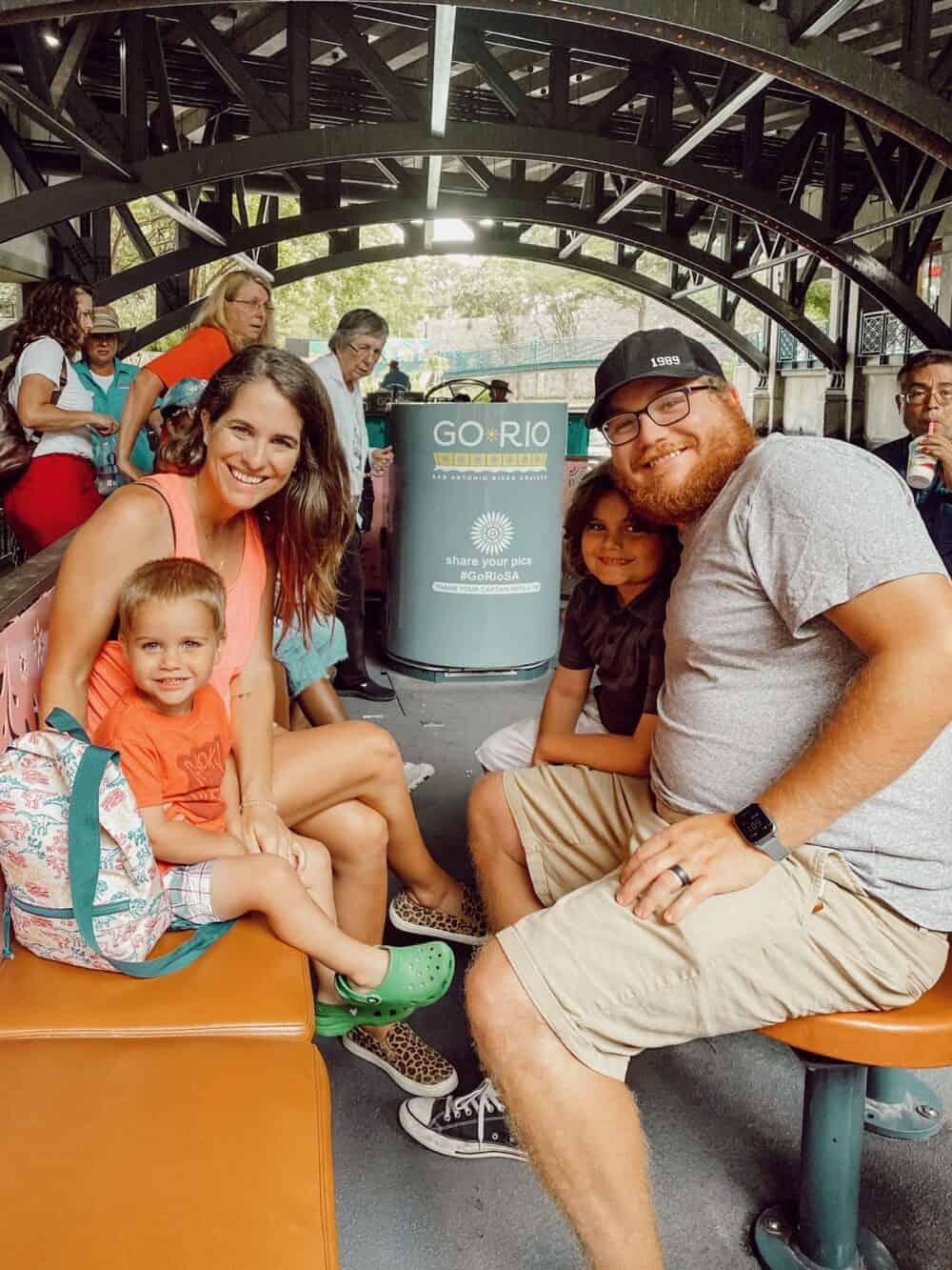 family posing for a photo on a riverboat tour