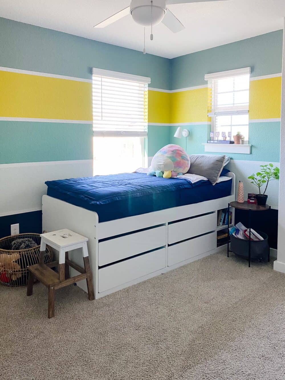 A bright and colorful kid bedroom with striped walls 