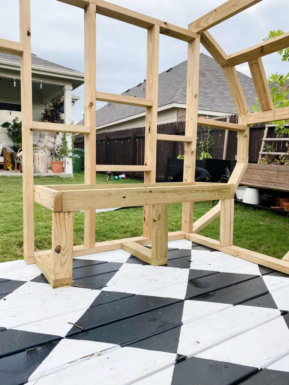 Interior of camper playhouse with built-in bench