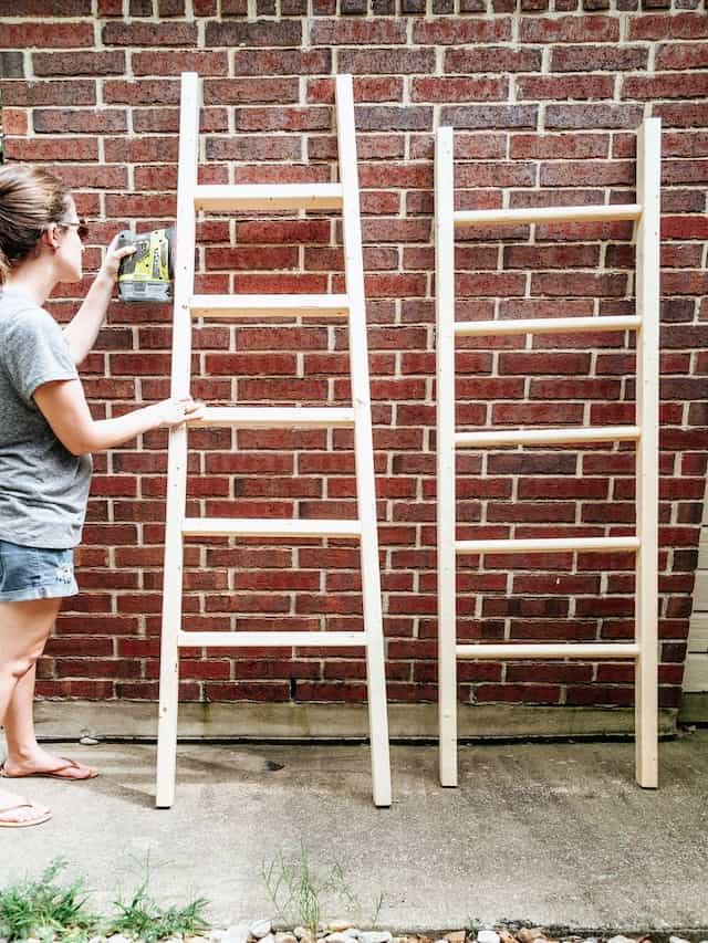 woman sanding a blanket ladder 