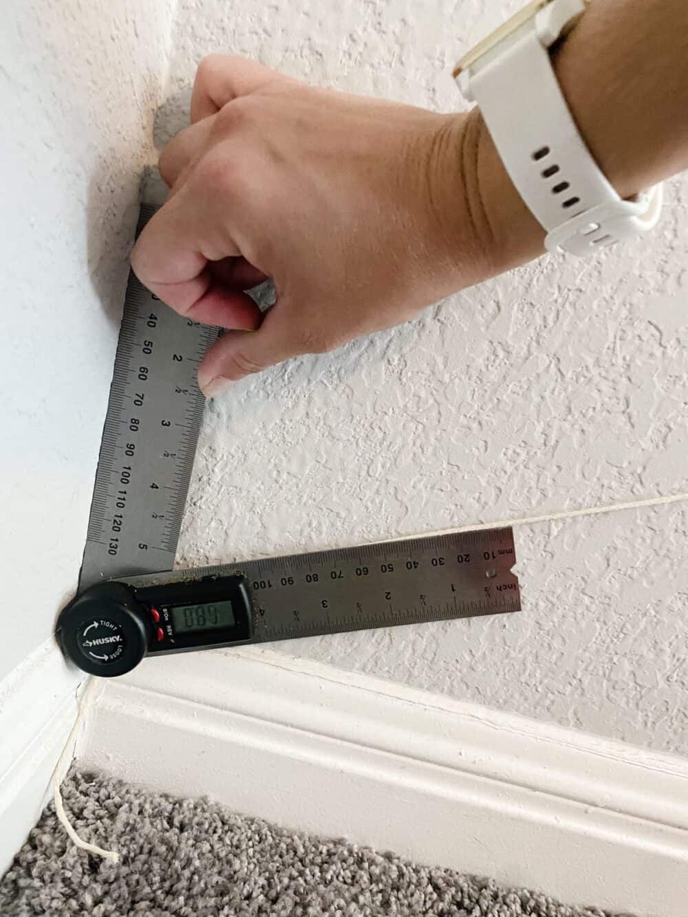 Hang using angle finder to find the angle to place trim