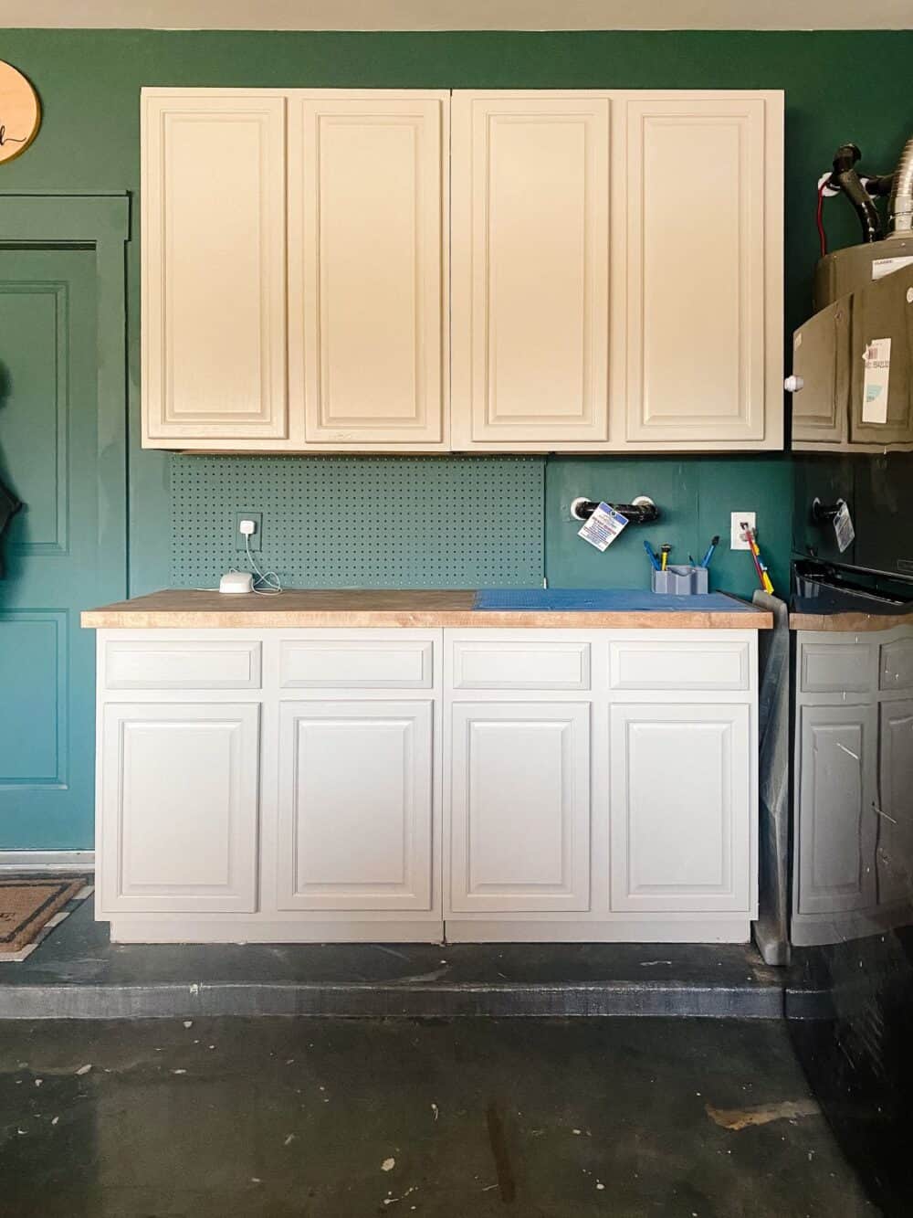 garage cabinets in a green and gray garage 