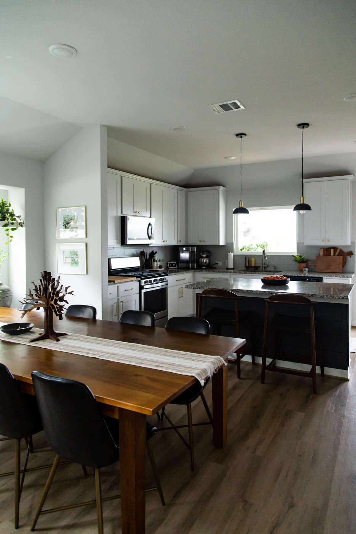 A neutral and simple dining room and kitchen