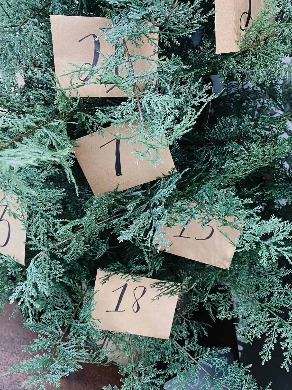 A close-up image of a DIY advent calendar with envelopes 