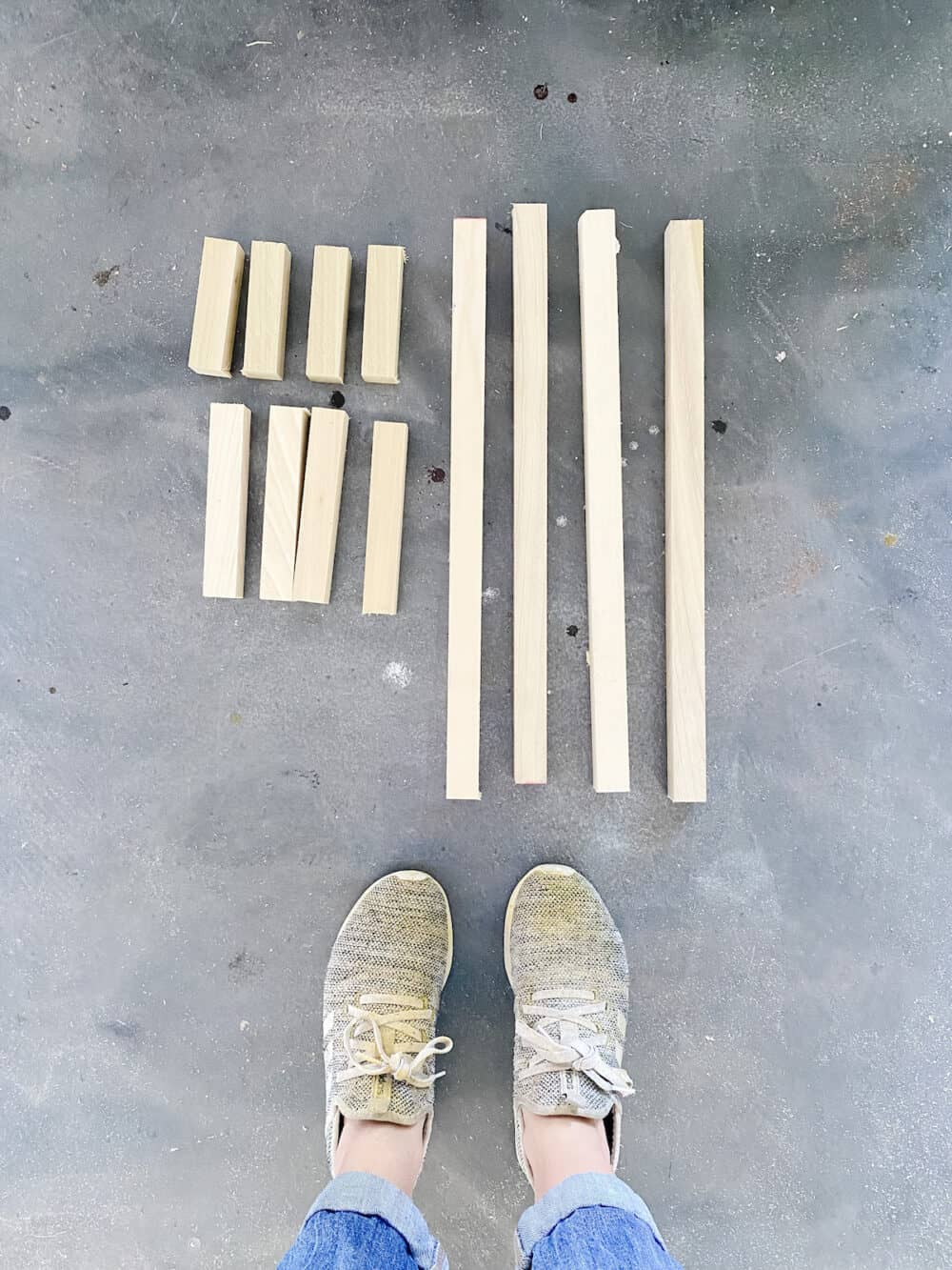 overhead shot of wooden dowels cut fot diy wood lantern