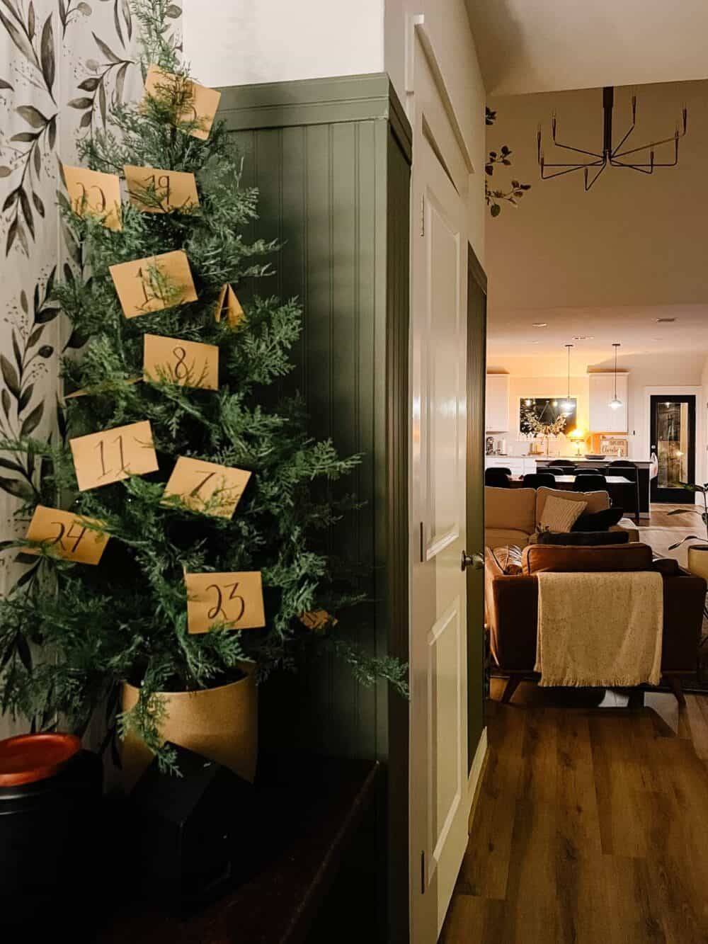 A tabletop tree with numbered envelopes on it 