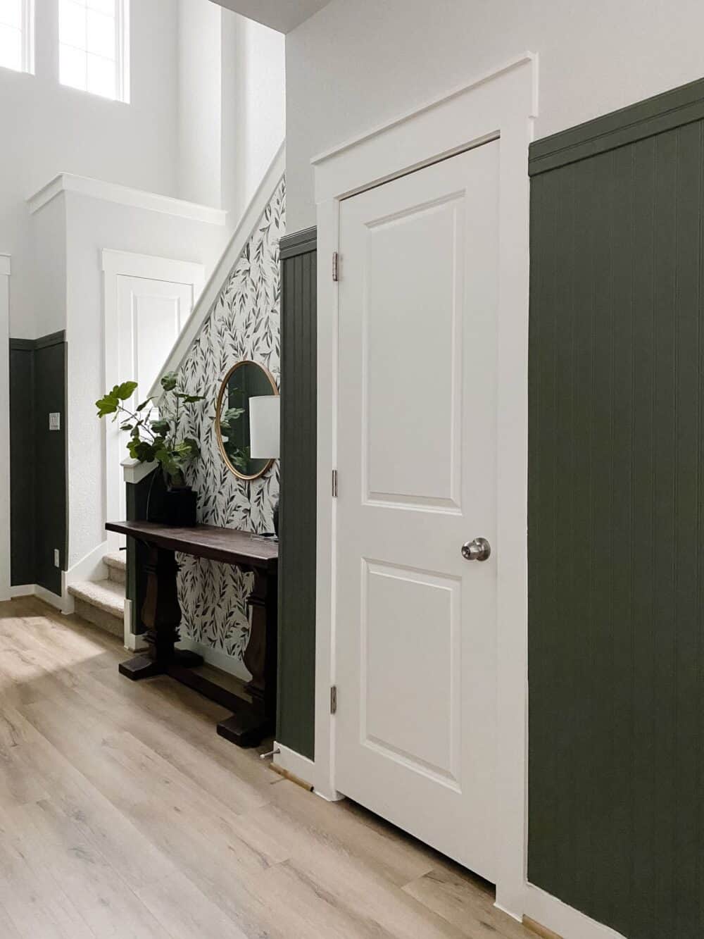 entry with a door to a powder room