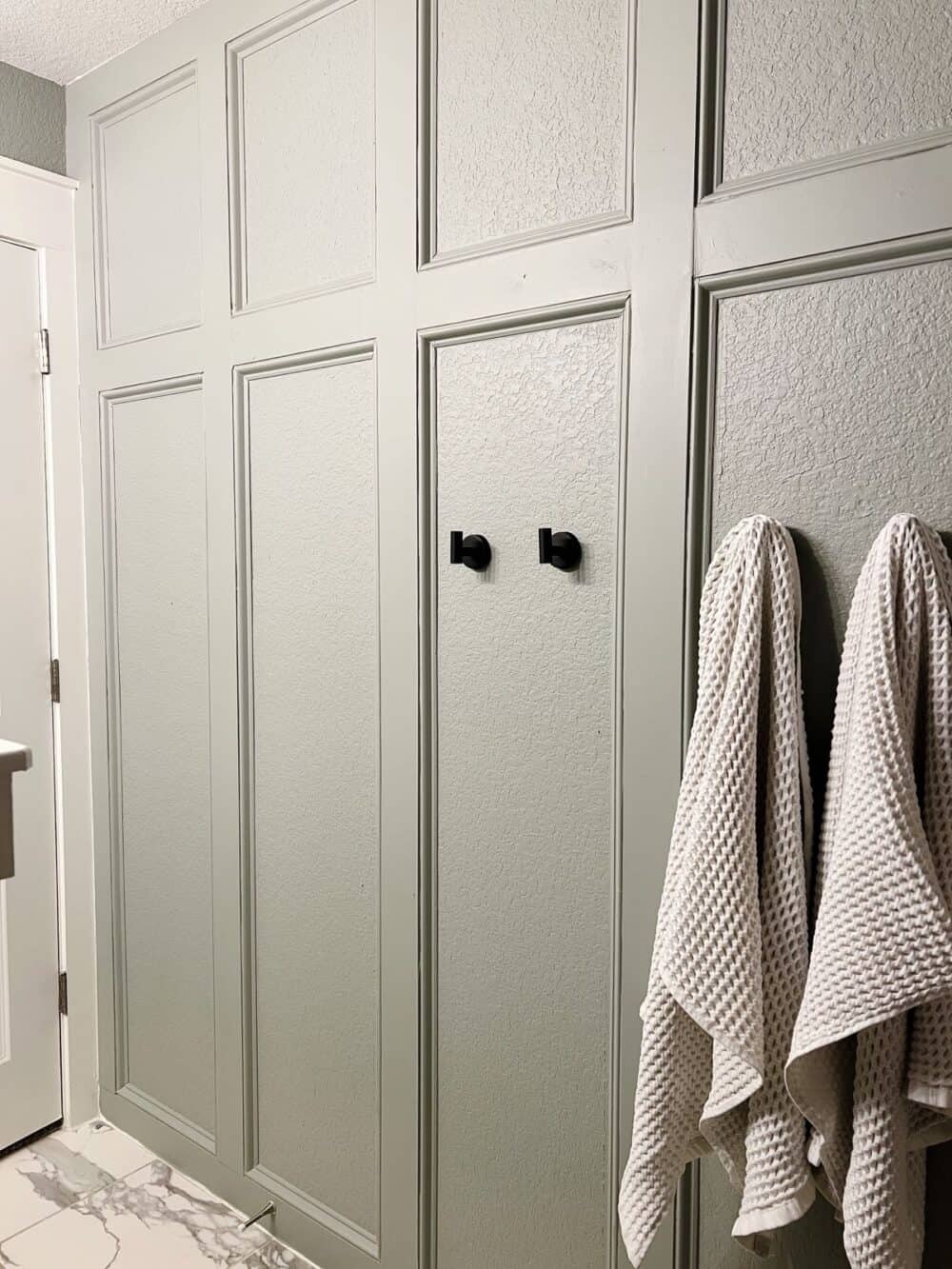 bathroom with trim accent wall painted with Magnolia Home Weathered Windmill