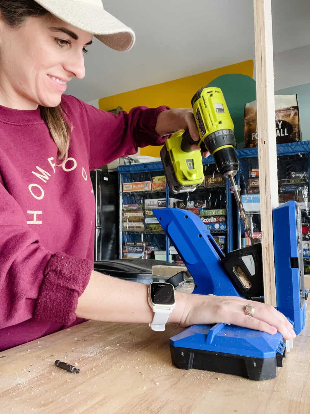 Woman using a Kreg Jig to drill pocket holes