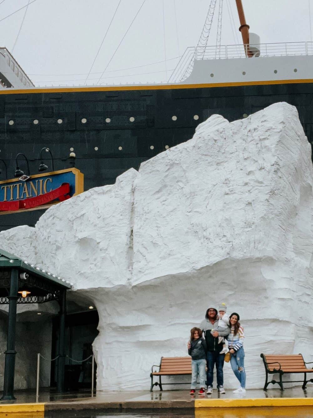 Family posing for a photo in front of the Titanic museum in Branson, MO 