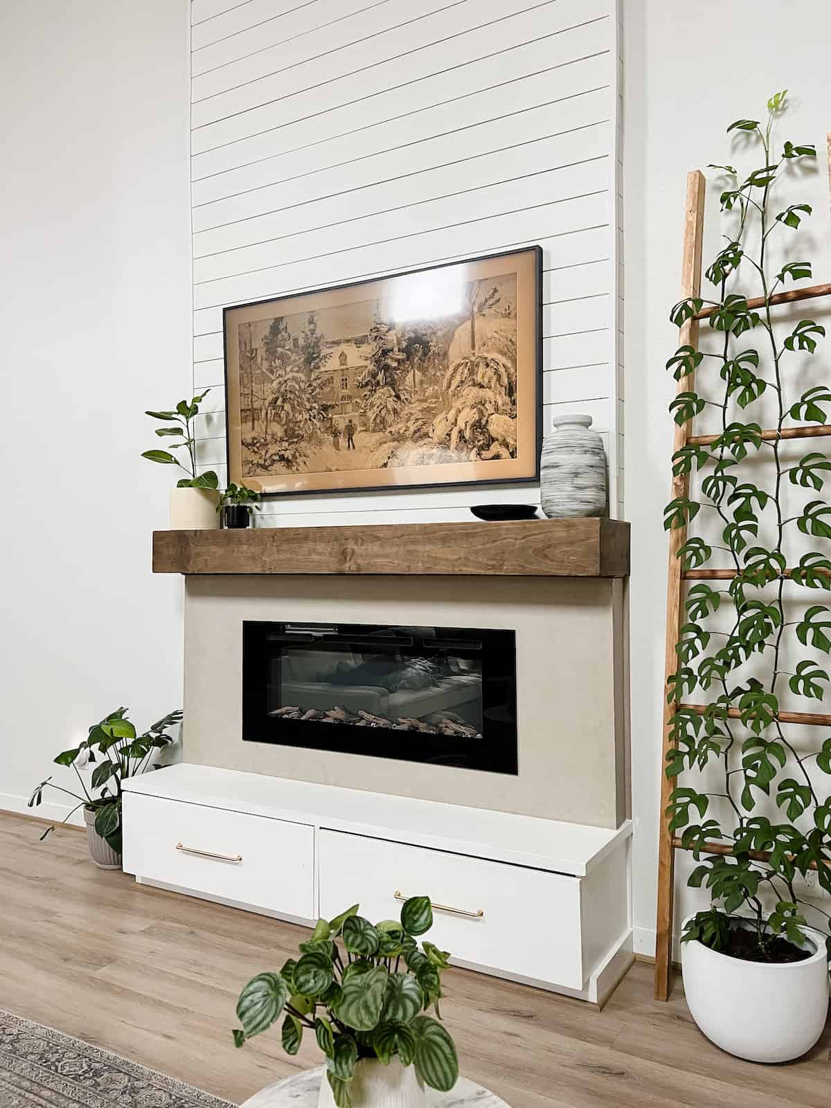 DIY electric fireplace with shiplap and roman clay