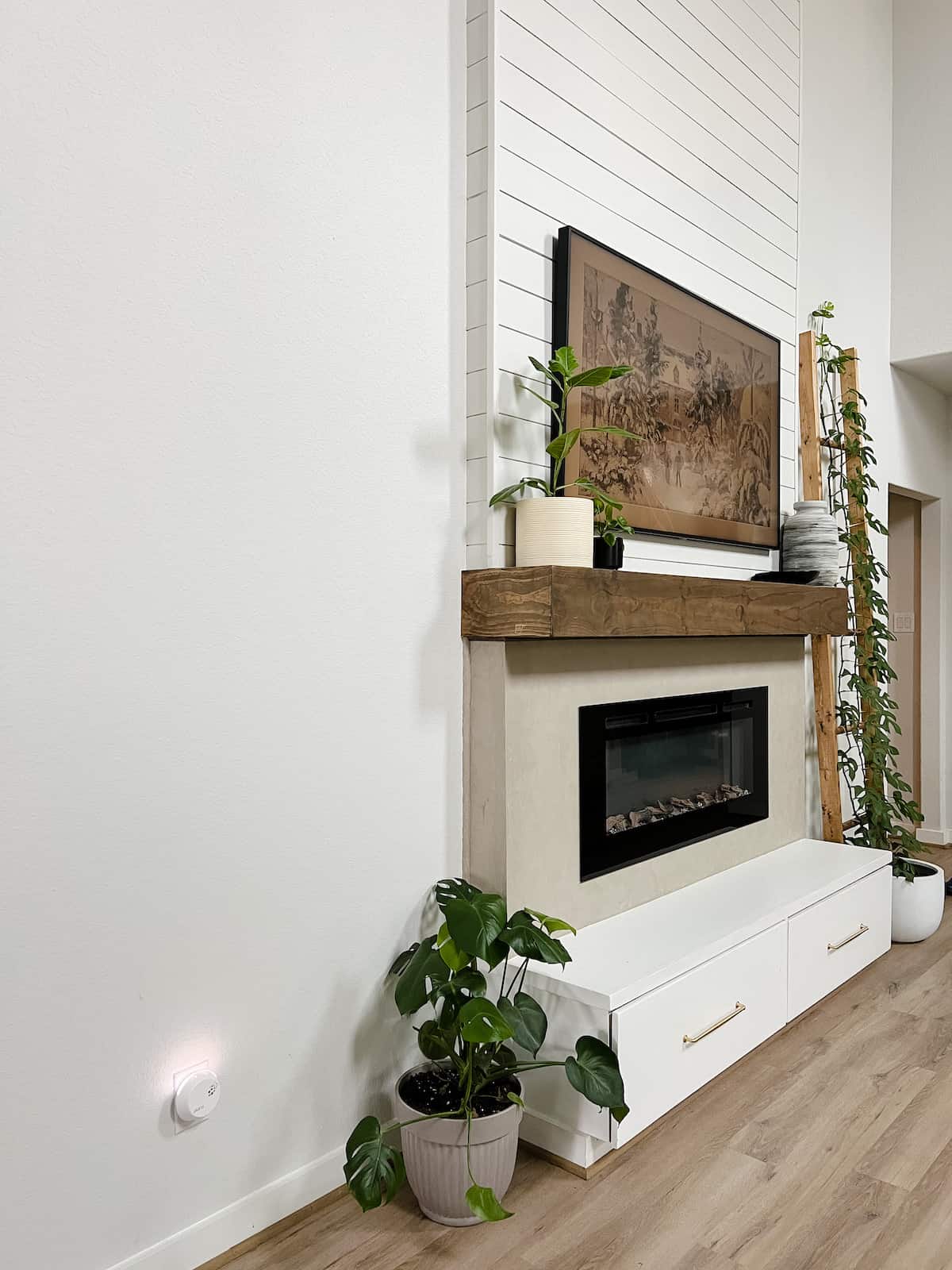 tall fireplace with shiplap and roman clay