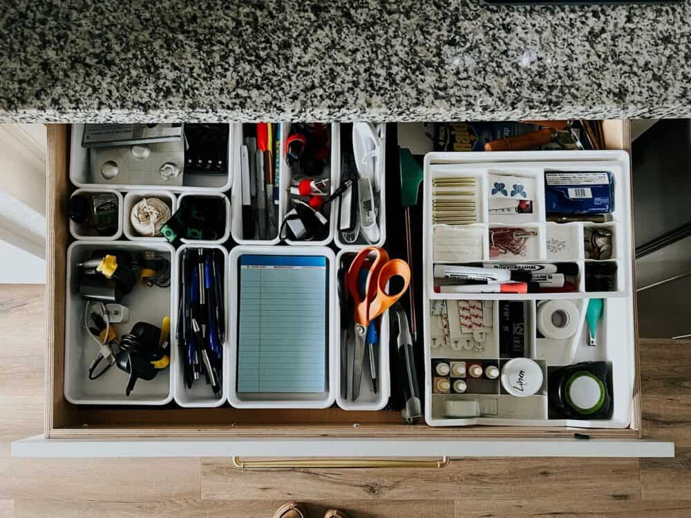 overhead view of an organized junk drawer 