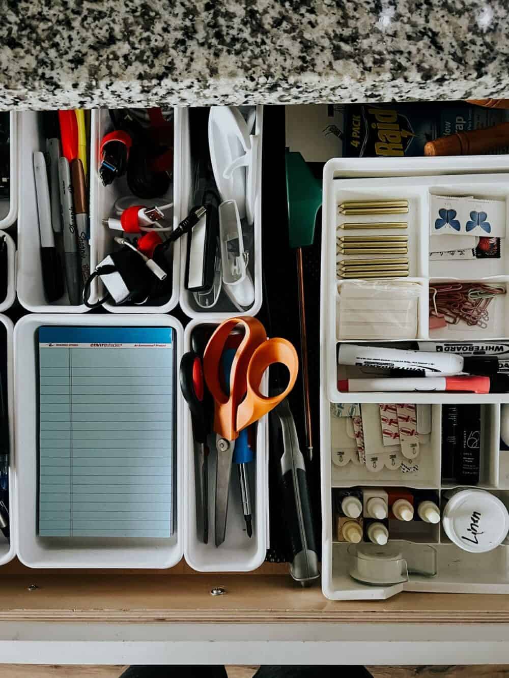 junk drawer organized with bins 